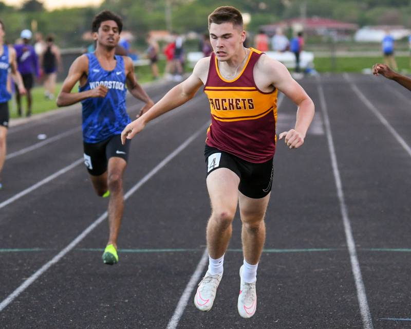 Richmon-Burton Jack Martens leans in at the finish line to win the heat of the 400 meter run on Tuesday May 7, 2024, during the Kishwaukee River Conference track meet held at Plano High School.