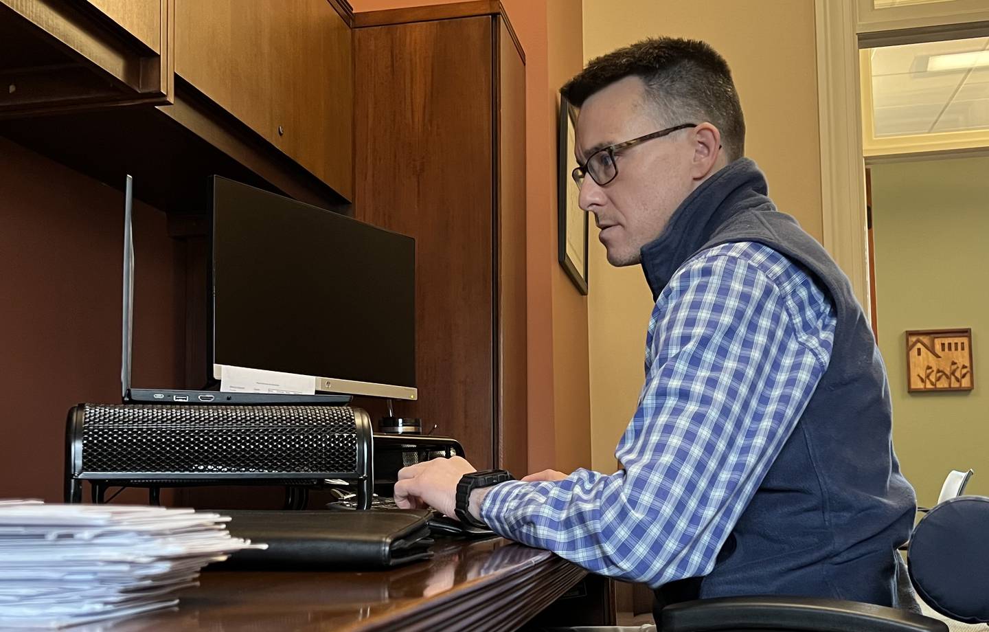 Director of DeKalb County Nonprofit Partnership, Ben Bingle sits at his desk in the DeKalb County Community Foundation Office on May 1, 2023, four days before the 10th annual Give DeKalb County fundraiser.