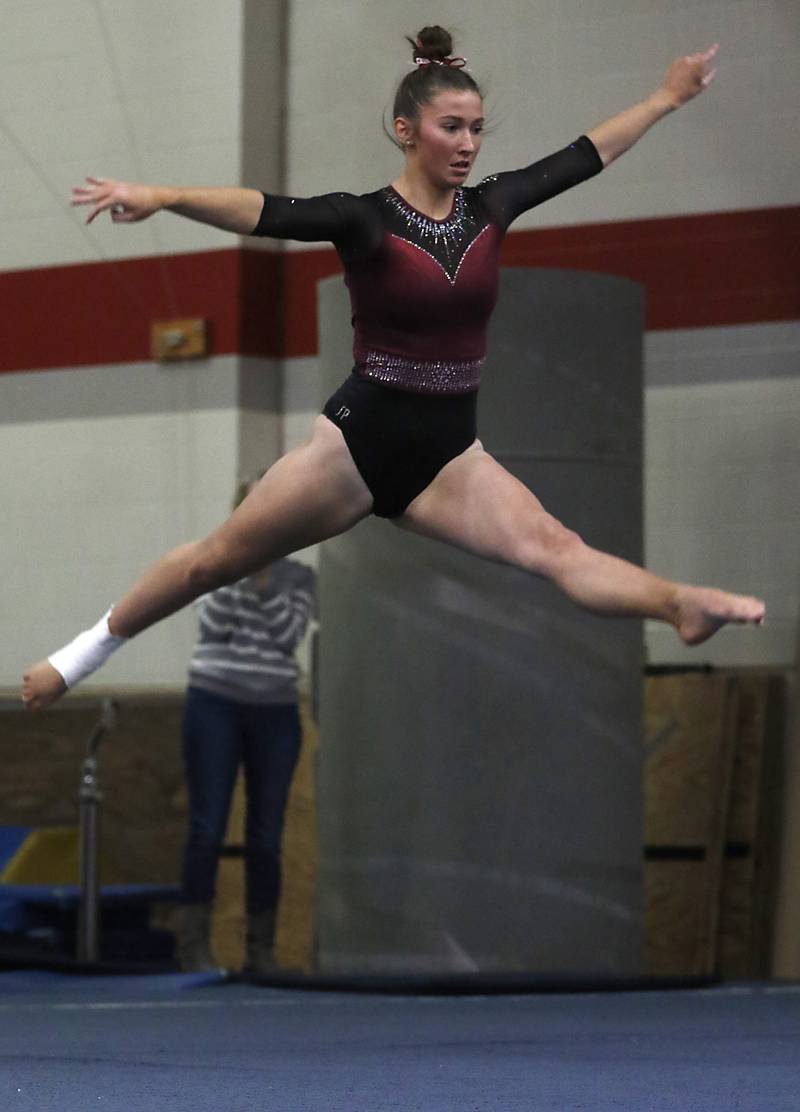 Prairie Ridge’s Thea Scheuer competes on the floor exercise during the IHSA Mundelein Gymnastics Sectional on Feb. 13, 2025, at Mundelein High School.