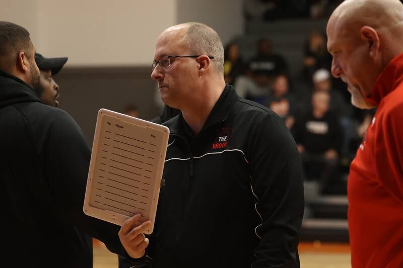 Bolingbrook head coach Rob Brost gets ready to talk to the team between quarters against Minooka on Tuesday, Dec. 17, 2024 in Minooka.