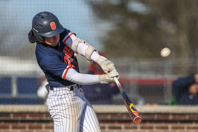 Oswego's Conor Tully (23) swings at a pitch during baseball game between Plainfield South at Oswego on Monday, April 14, 2025 in Oswego.