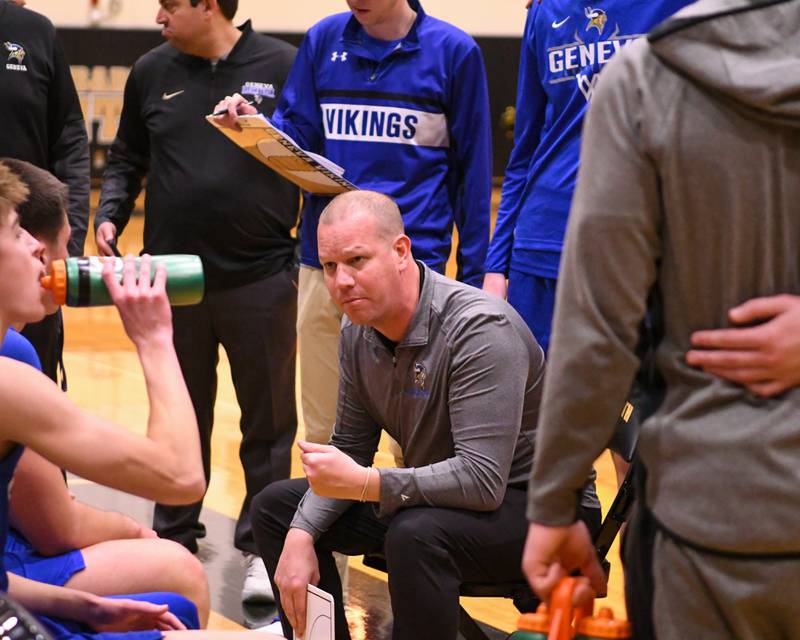 Geneva's head coach Brad Wendell talks to the team during a timeout in the game on Tuesday Jan. 6, 2025, while traveling to take on Glenbard North High School.