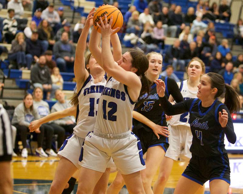 Geneva's Gabby Webb grabs the rebound against St. Charles North on Friday, Jan. 17,2025 in Geneva.