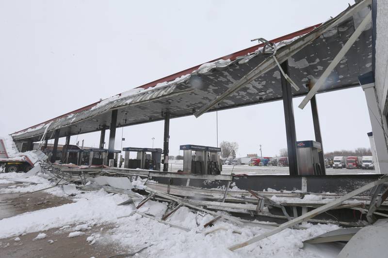 Debris from a large section of canopy lays on the ground after being struck by an Ace Hardware semi truck on Friday, Jan. 12, 2024 in Princeton.