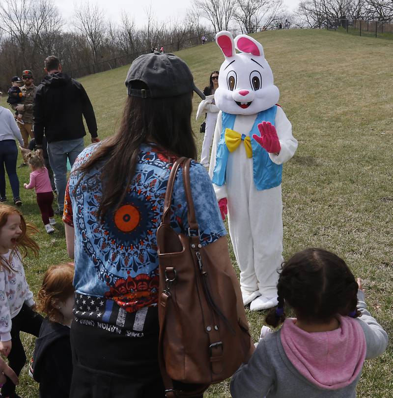 The Easter bunny waves to children on Saturday, April 19, 2025, during the Johnsburg Easter Egg Hunt at Sunnyside Memorial Park, in Johnsburg. Children hunted for 6,000 candy-filled eggs in three hunts divided by age group.