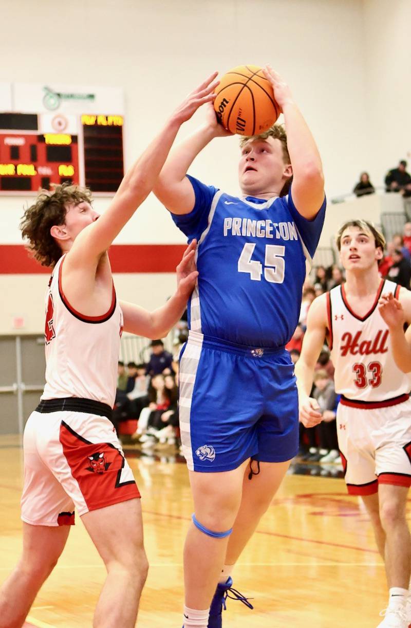 Princeton's Jordan Reinhardt shoots against the Red Devils Friday night at Hall High School. The Red Devils won 62-54.