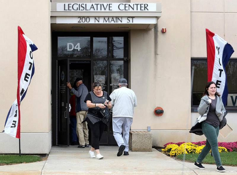 Shaw Local 2021 file photo - Voters enter and leave the DeKalb County Legislative Center in Sycamore in April 2021, taking advantage of the last day of early voting before Tuesday's election.