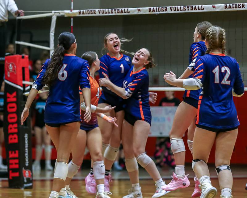 Romeoville's Aubree Westerfield (1) celebrates the win with teammates over Bolingbrook.  Oct 3, 2024 in Bolingbrook.