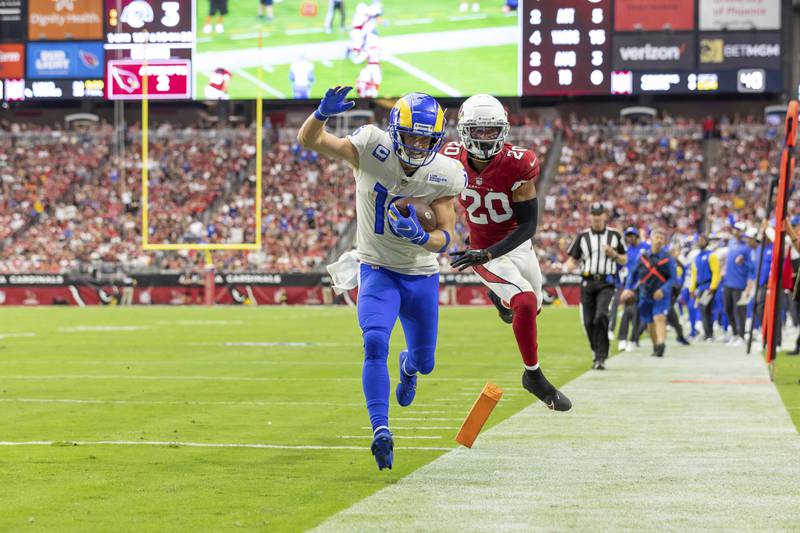 Wide receiver (10) Cooper Kupp of the Los Angeles Rams runs the ball for a touchdown against the Arizona Cardinals in an NFL football game, Sunday, Sept. 25, 2022, in Glendale, AZ. Rams won 20-12. (AP Photo/Jeff Lewis)