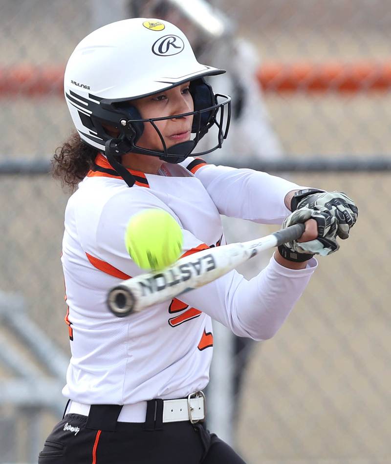DeKalb’s Sydney Myles pops the ball up during their game against Rockford Auburn Wednesday, March 15, 2023, at DeKalb High School.
