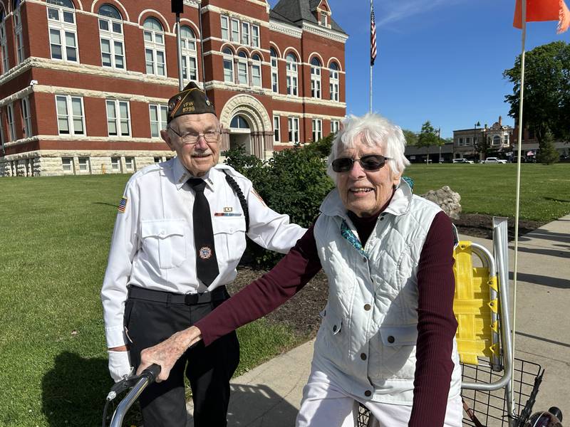 Korean War Veteran Stan Eden stopped to talk with Marine Kuethe who rode her bicycle to the laying of the wreaths on Lorado Taft's Soldiers and Sailors Memorial on the lawn of the historic Ogle County Courthouse on Memorial Day, Monday, May 26, 2025. The Memorial Day program continued at Riverside Cemetery after a wreath was dropped into the Rock River at Oregon Park East in honor of veterans who served at sea.