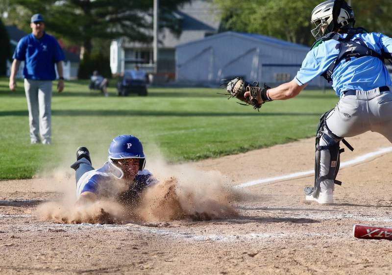 Princeton's Augie Christiansen slides in for a run against Bureau Valley Thursday at Prather Field. The Tigers won 12-2.