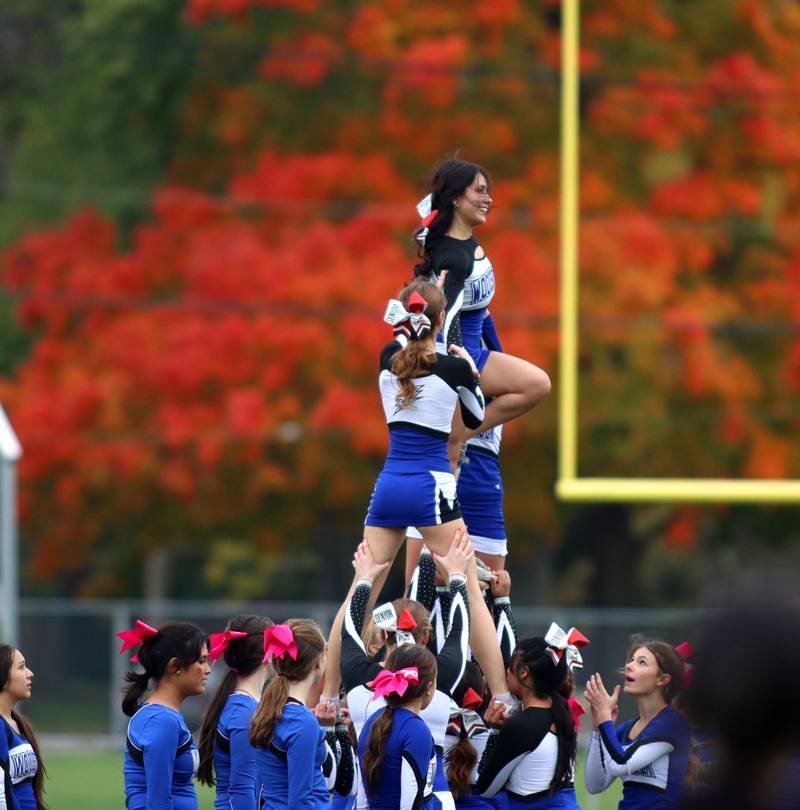 Woodstock girls entertain during halftime against Ottawa in varsity football at Larry Dale Field on the campus of Woodstock High School Saturday.