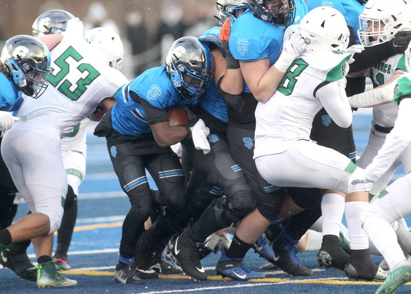St. Francis’ Dash Dorsey (1) is squeezed by the Providence defense during their Class 4A semifinal game in Wheaton on Friday, Nov. 19. 2022.
