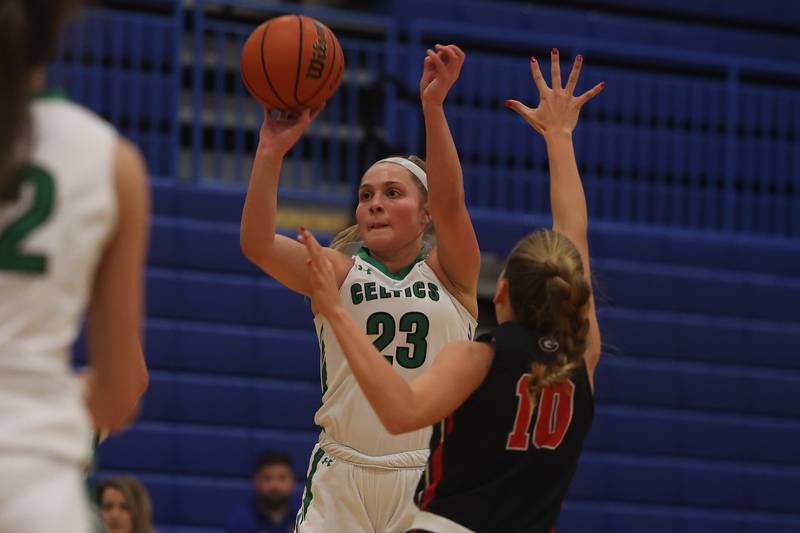 Providence’s Annalise Pietrzyk takes the contested shot against Glenbard East in the 2022 Carl Sandburg Girls Basketball Holiday Classic.