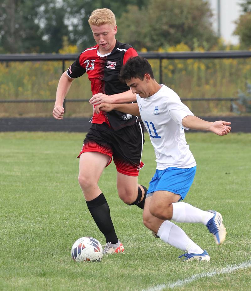 Indian Creek's Everett Willis (left) and Hinckley-Big Rock's Josh Badal fight for possession during their game Wednesday, Sept. 20, 2023, at Pack Park in Waterman.