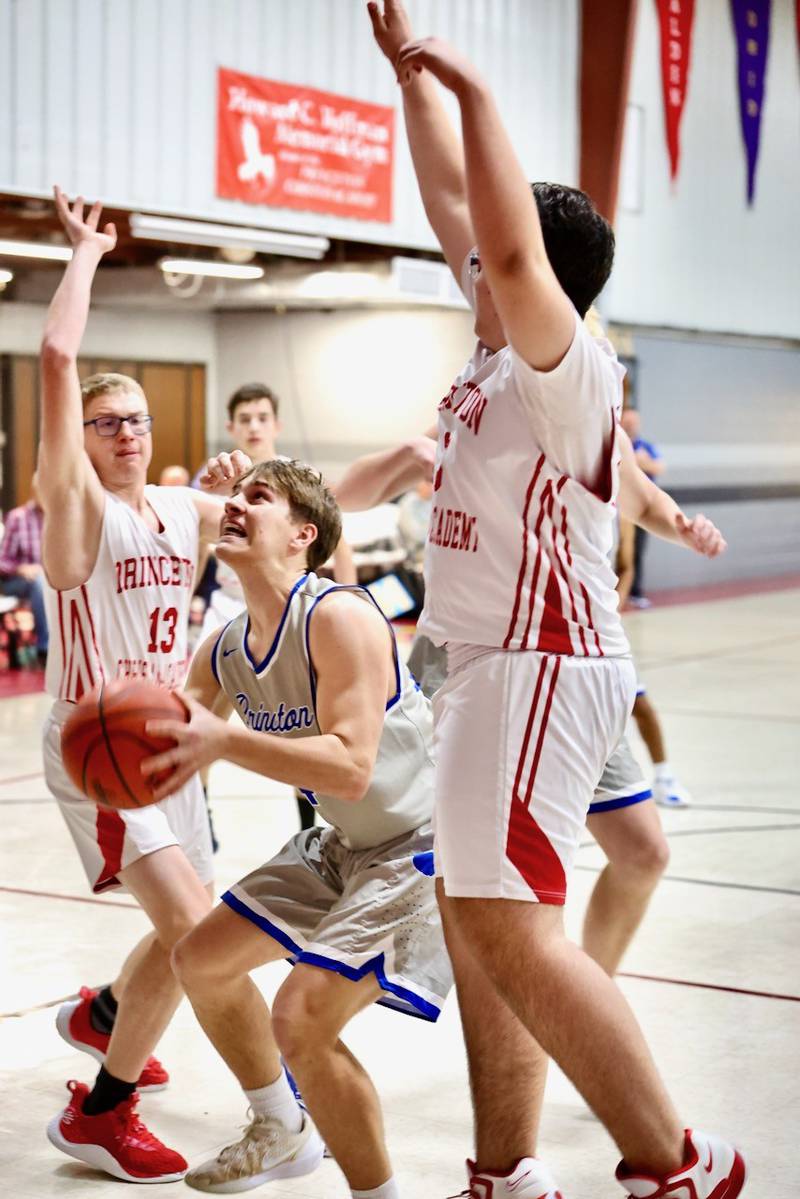 Princeton's Sheperd Bayer shoots between PCA's Trustin Crew (13) and Max Gibson in Thursday's JV game at Howard Hoffman Memorial Gymnasium.