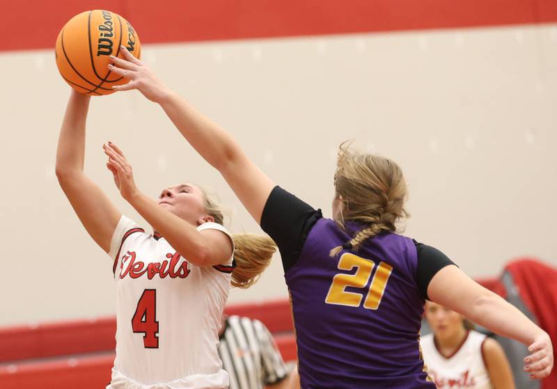 Hall's Charlie Pellegrini eyes the hoop on a layup as Mendota's Addison Perryman defends on Monday, Dec. 1, 2025 at Hall High School.