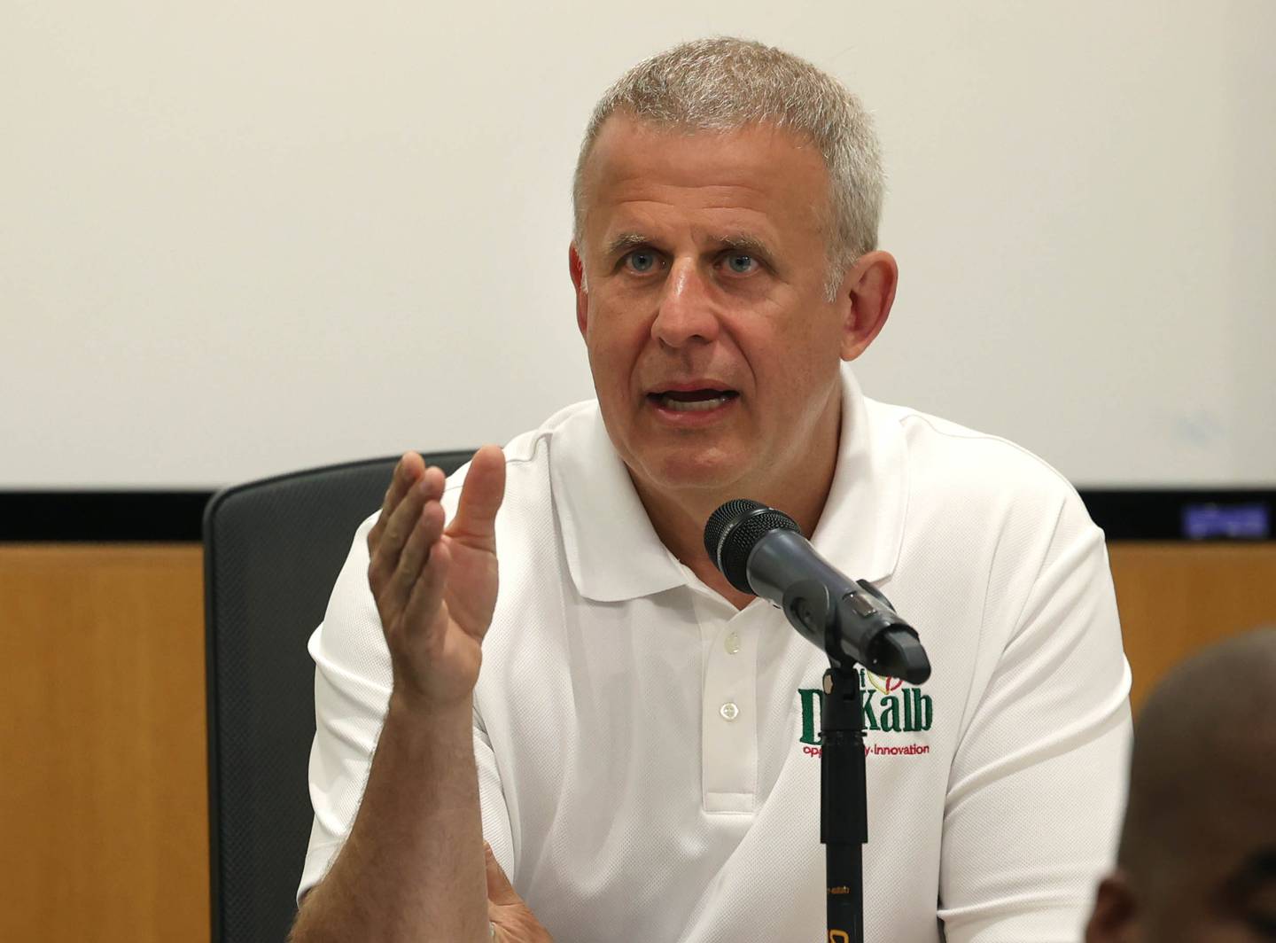 DeKalb Mayor Cohen Barnes thanks retiring DeKalb Fire Chief Mike Thomas for his service Monday, June 23, 2025, during the DeKalb City Council meeting at the DeKalb Public Library.
