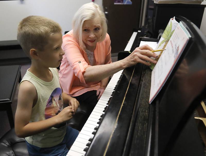 Piano teacher Janice Larson Razaq teaches Gregory Elfers, 7, of Rolling Meadows, during a piano lesson Thursday, June 15, 2023, at her office at Harper College, in Palatine. Razaq was awarded 2023 Teacher of the Year by the Music Teachers National Association.