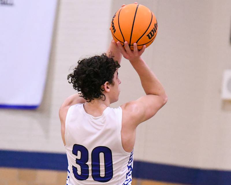 Riverside-Brookfield's Liam Enright (30) takes a shot during the game on Tuesday Feb. 3, 2026, while taking on Glenbard East held at Riverside-Brookfield High School.