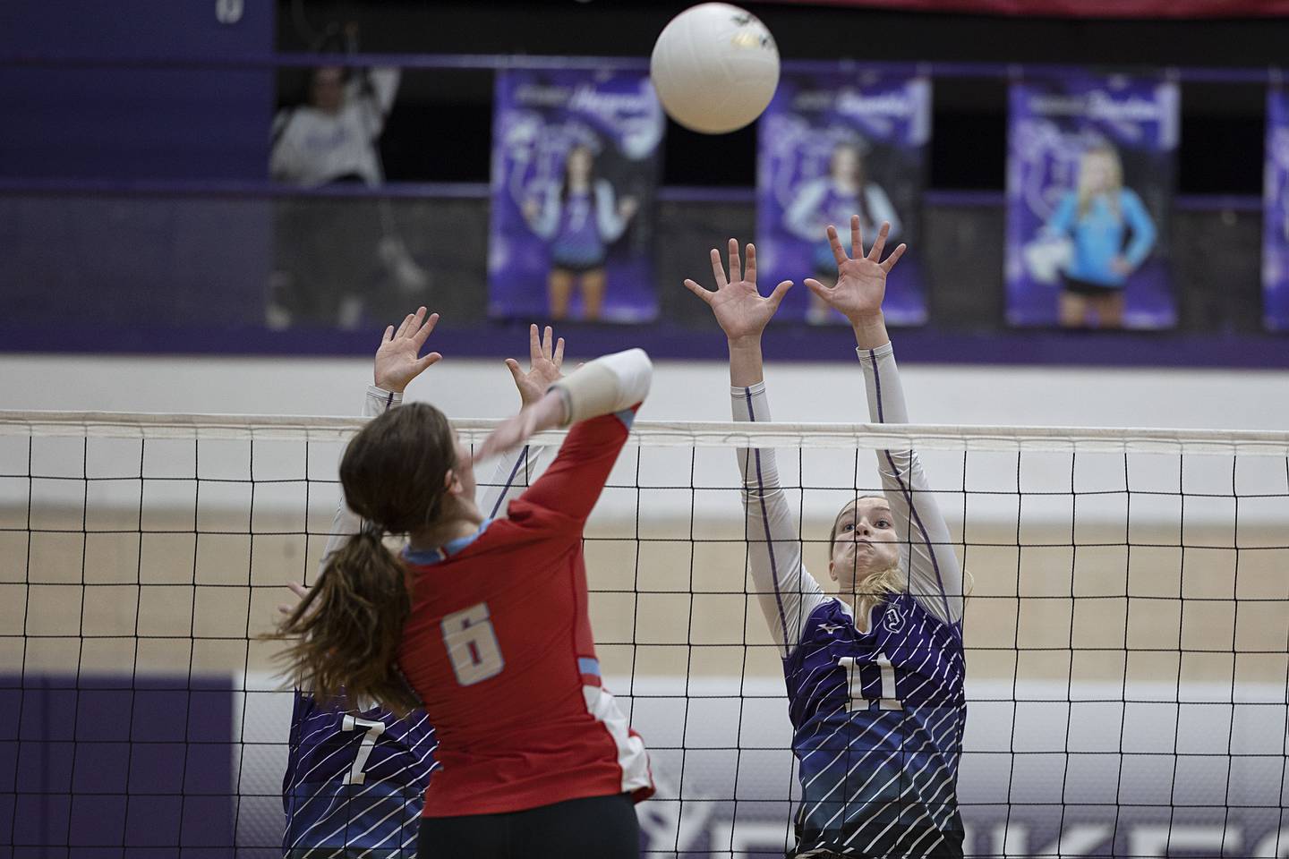 Dixon’s Sydney Hargrave (left) and Ella Govig go up to block a shot against Ottawa’s Mel Pries in the regional semifinal Tuesday, Oct. 25, 2022.