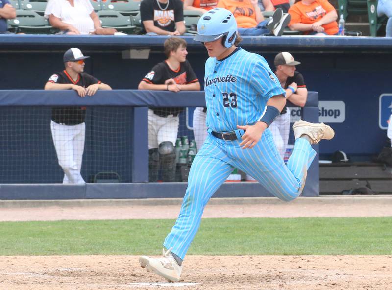 Marquette's Grant Dose scores the team's sixth run during the Class 1A State championship game on Saturday, June 1, 2024 at Dozer Park in Peoria.
