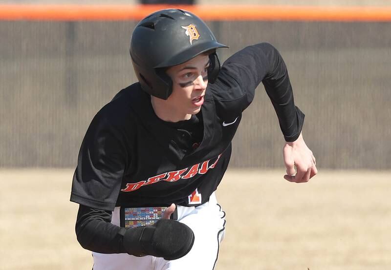 DeKalb’s Jackson Kees hustles to third during their game against Dixon Tuesday, March 28, 2023, at DeKalb High School.