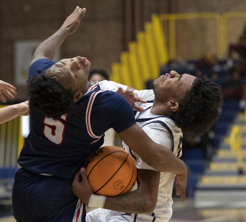 Sterling’s Kaedon Phillips (right) and St. Viator’s Dayvion Ellis collide Monday, Jan. 20, 2025, during Sterling’s MLK Classic.