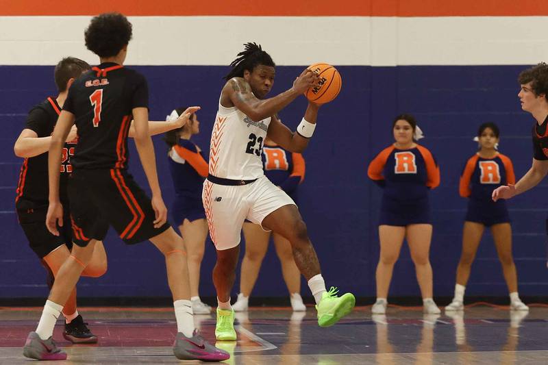 Romeoville’s Damion Porter Jr. pulls in the rebound against Plainfield East on Monday, Dec. 16, 2024 in Romeoville.