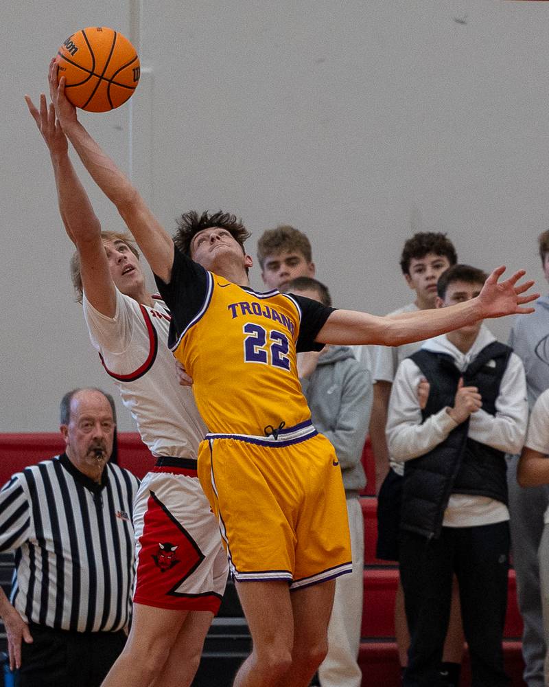 Carter Wujek (22) of Mendota and Hunter Edgcomb (12) of Hall leap for rebound in the championship game of the Colmone Classic on Saturday, December 20, 2025 at Hall High School in Spring Valley.