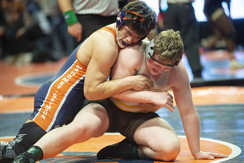 Mateo Casillas (left) of Mahomet-Seymour works on Joliet Catholic's Oewn Gerdes in 195lbs during the 2A  third place match at the IHSA state wrestling meet on Saturday, Feb. 19, 2022.