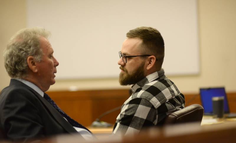 Cody Neuschwanger (right) speaks with his attorney Michael Johnson prior to closing arguments at his bench trial in Ogle County Court on Thursday, May 11, 2023. He is accused of killing Devin Bailey outside a Rochelle home on Oct. 29, 2020.