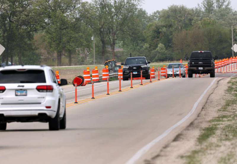 Traffic makes its way through the roadwork cones on Peace Road Thursday, May 15, 2025, as construction continues on the section between Route 64 and Freed Road in Sycamore.