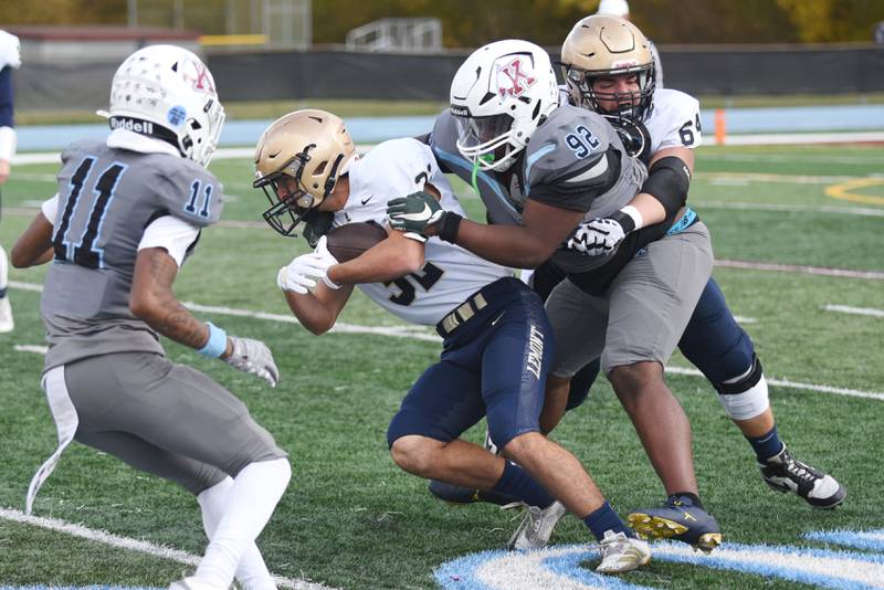 Kankakee's Camron Johnson (92) tackles Lemont's Andrew Ascolani during an IHSA Class 5A playoff game at Kankakee Saturday, Nov. 1, 2025.