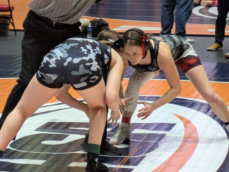 Larisza Gomez-Guevara reacts after giving up a two-point nearfall at the third-period buzzer of a 10-8 loss of the third-place match at the IHSA Girls Wrestling State Championship on Saturday in Bloomington.