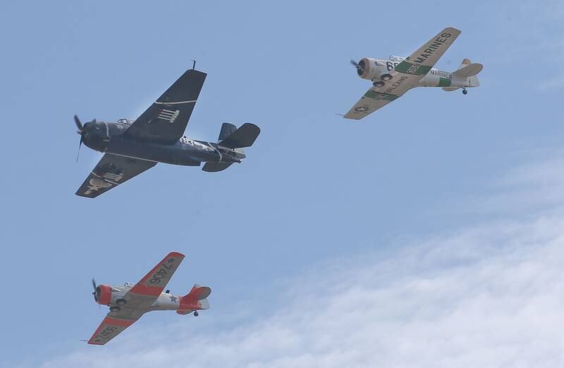 A TBM and a pair of T-6 Texans fly over the annual Pearl Harbor parade and memorial service on Saturday in Peru. This year marks the 83rd anniversary of the Dec. 7, 1941, attack on Pearl Harbor.