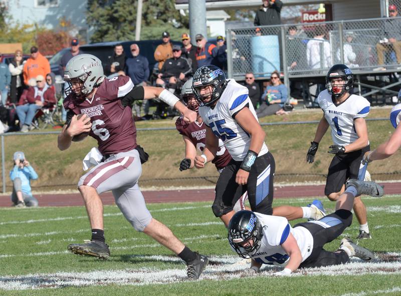 Rockridge quarterback Cullen Schwigen (6) breaks away from Eastland-Pearl City defenders in 2A state football playoffs first round action on Saturday, Nov. 2, 2024 at Eddington.