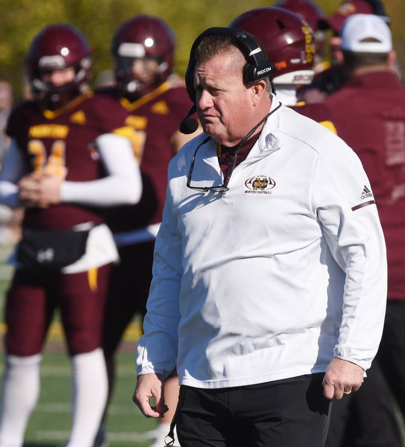 Joe Lewnard/jlewnard@dailyherald.com
Montini head football coach Michael Bukovsky and the Broncos get ready for the start of the Class 3A semifinal game against Byron Saturday.