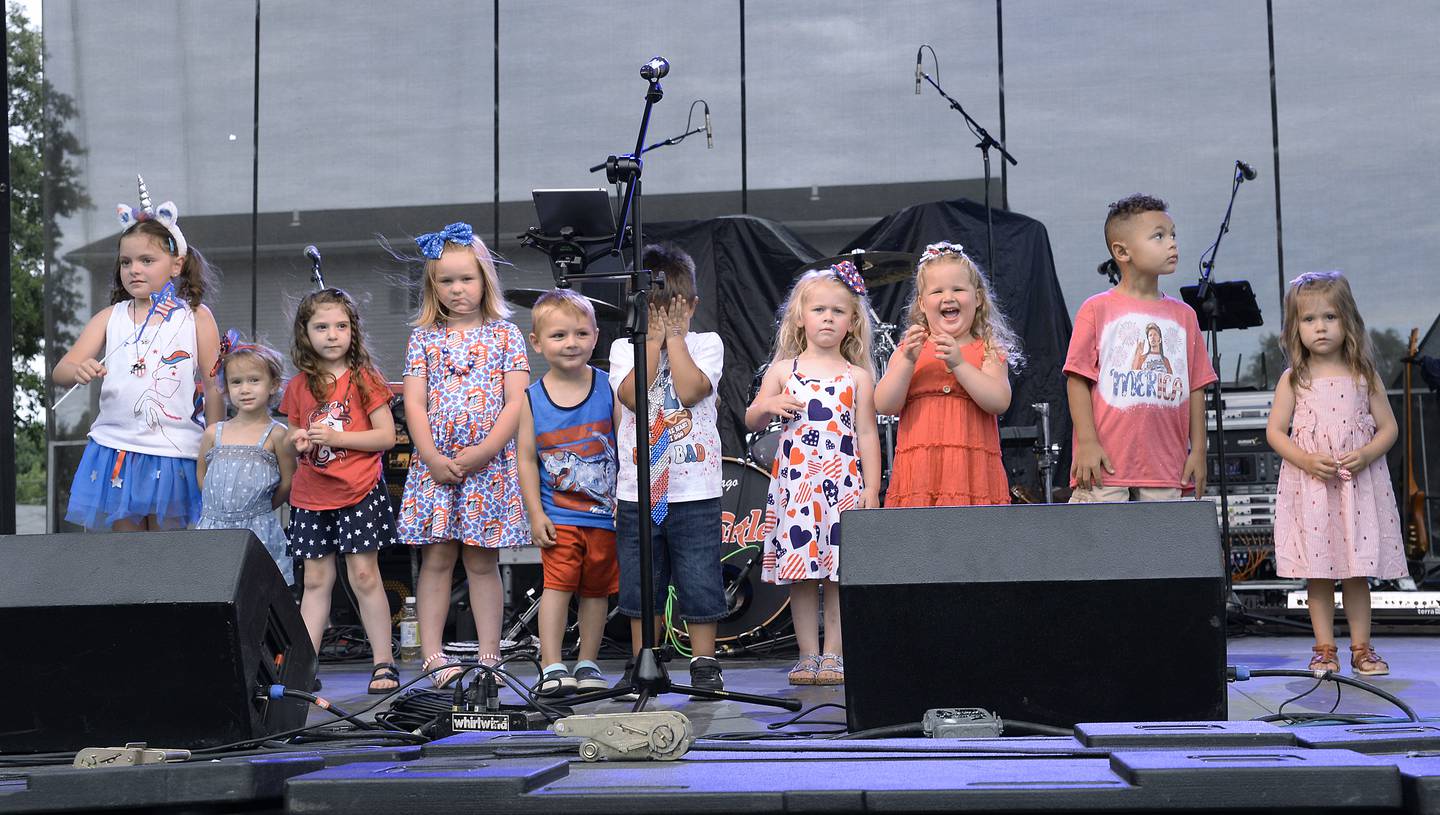 The candidates for Lil Miss Sparkler and Mr. Firecracker line up to await the winner announced Wednesday, July 6, 2022, during Streator's 4th of July Celebration opening ceremonies at Northpoint Plaza.