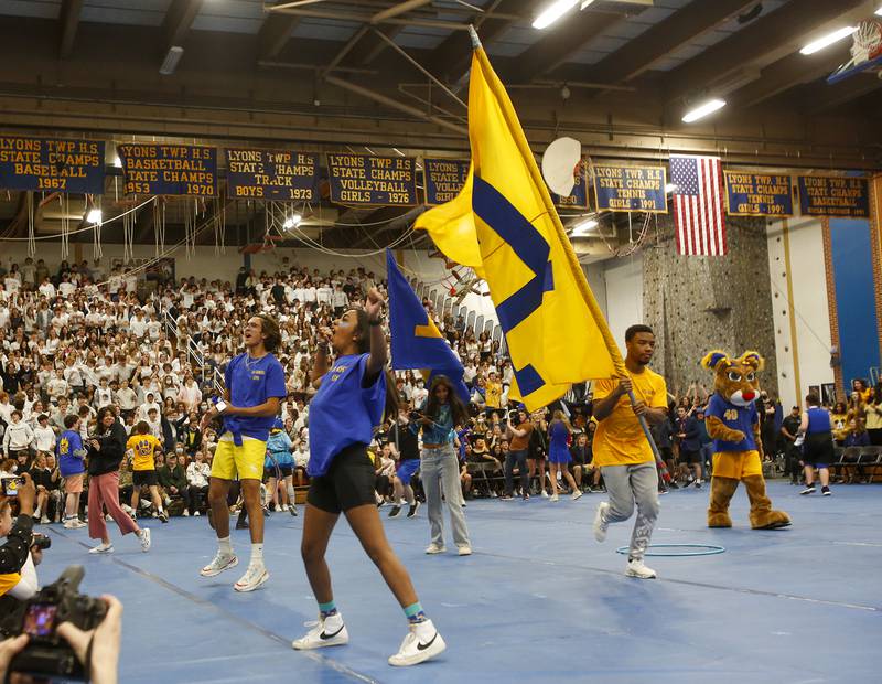 Lyons Township students pump up the crowd during an all-school assembly in La Grange on Friday, April. 22, 2022.