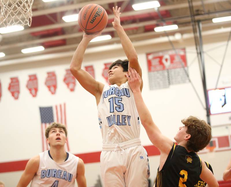 Bureau Valley's Corban Chhim drives to the basket to score on a layup over Putnam County's Drew Taliani during the 49th annual Colmone Class on Thursday, Dec. 7, 2023 at Hall High School.