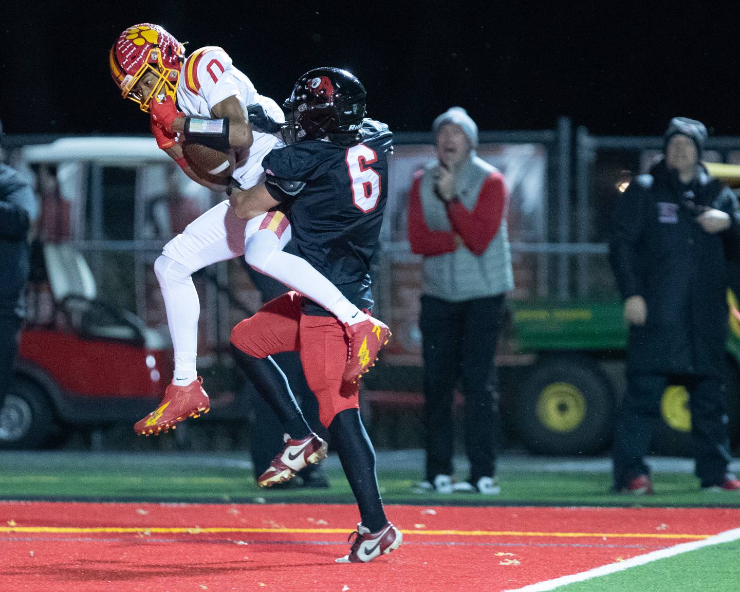 Batavia's Darin Ashiru makes the jumping catch for a touchdown as Glenbard East's Abdul Muslah looks to intercept the ball at the Class 7 A Second Round playoff game on Friday, Nov. 7,2025 in Lombard.