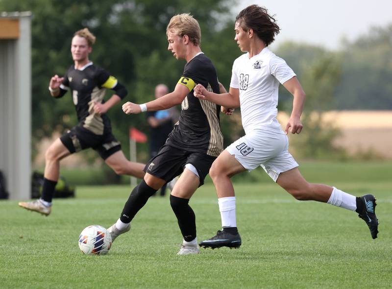 Sycamore's Gavin Crouch takes a shot in front of Kaneland's Dylan Pilz during their game Monday, Oct. 6, 2025, at Sycamore High School.