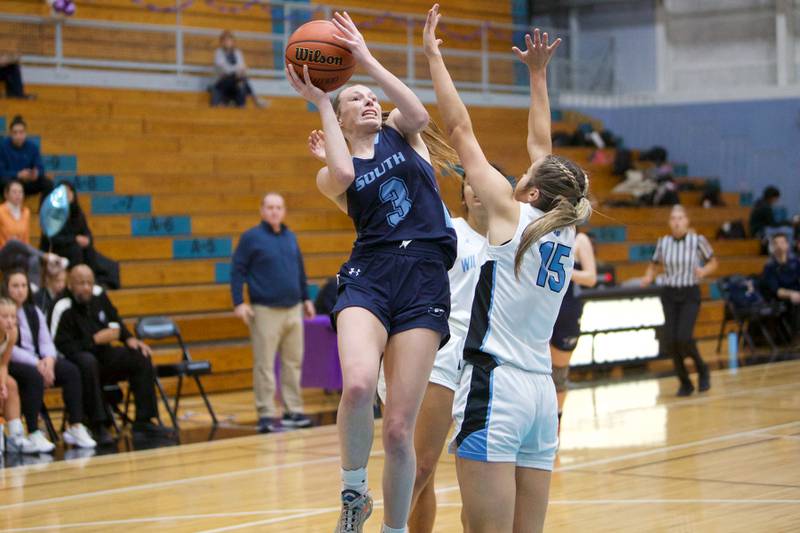 Downers Grove South's Emily Petring puts the shot up over Willowbrooks Sarah Stout on Friday, Feb.3,2023 in Villa Park.