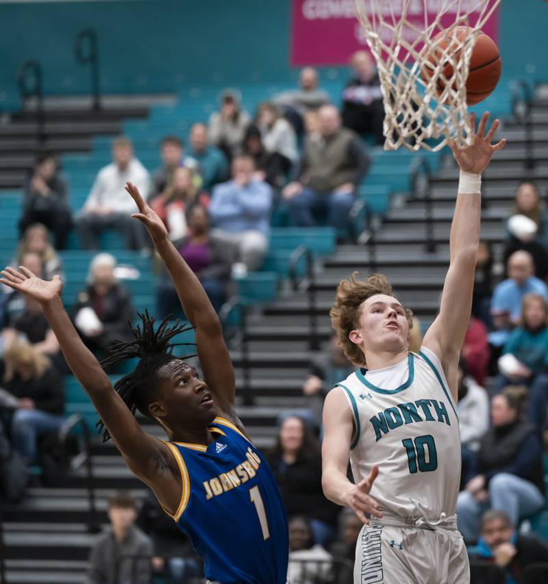 Woodstock North's Trevor Mark gets a shot over Johnsburg's Jarrel Albea during their game on Wednesday, January 31, 2024 at Woodstock North High School. Ryan Rayburn for Shaw Local