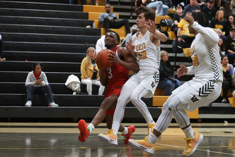 Yorkville’s Dayvion Johnson works his way in for a shot against Joliet West on Friday, Jan. 5th, 2024. in Joliet.