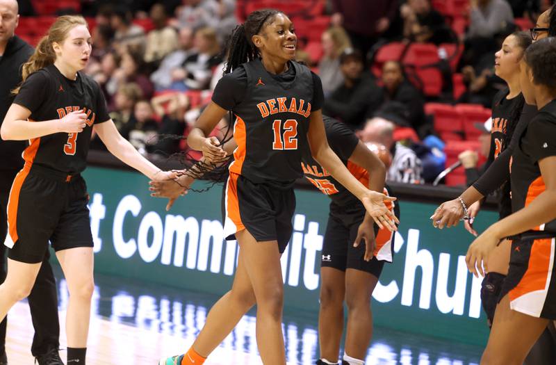 DeKalb's Brytasia Long is congratulated by her teammates after scoring and causing Sycamore to take a timeout during their game Friday, Jan. 31, 2025, in the FNBO Challenge in the Convocation Center at Northern Illinois University in DeKalb.