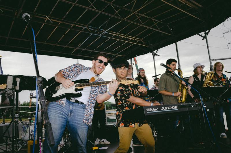 AJ Schmall (left) and Jonathan Rivera (right) perform alongside the live horn section of their band BAJA.