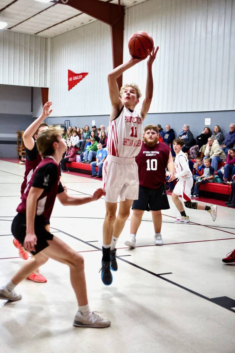 Princeton Christian Academy's Andrew Gibson shoots in the lane against Ottawa Christian Academy Tuesday at Howard Hoffman Memorial Gym. The Eagles won 57-42.